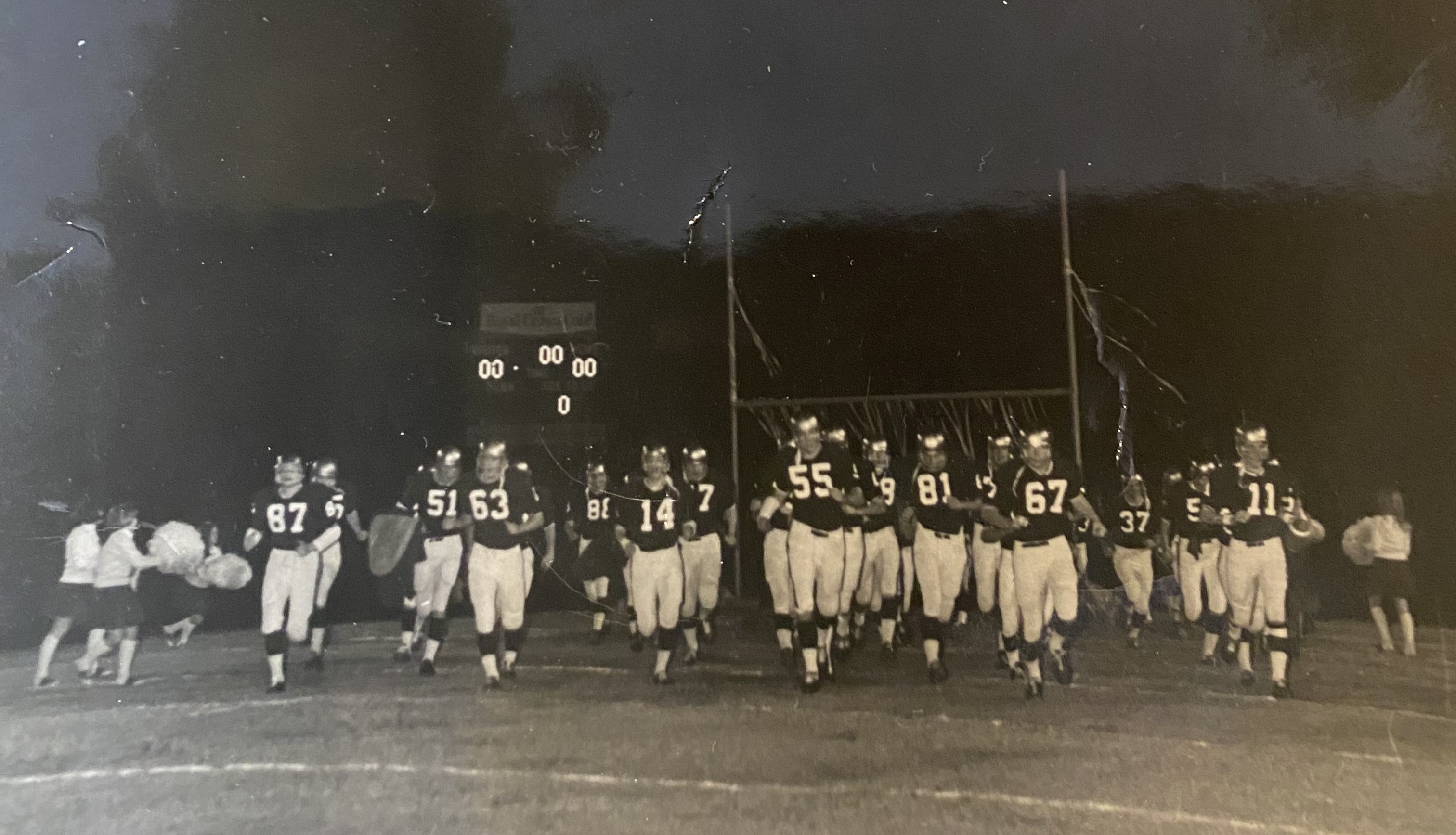 Saint Pius running on the field at home in our first game in 1968! I am #55!! 