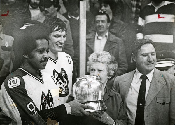 Captains Wayne Turner and Dave Archambault accept the Beanpot trophy in 1980.